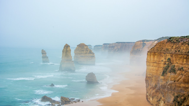 Foggy beach ocean cliffs volumetric free wallpaper - medium preview image