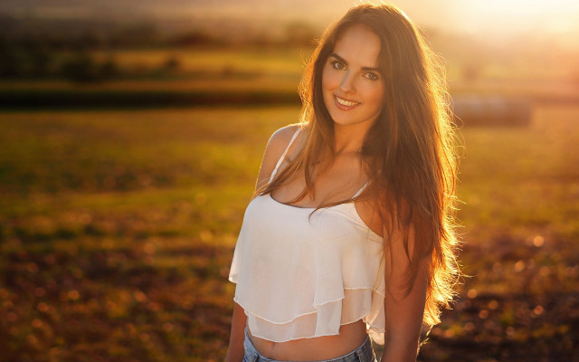 Woman field blowing hair smile free wallpaper - medium preview image