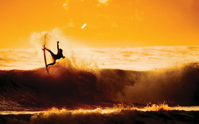 Surfer air wave sunset cliff free wallpaper - medium preview image