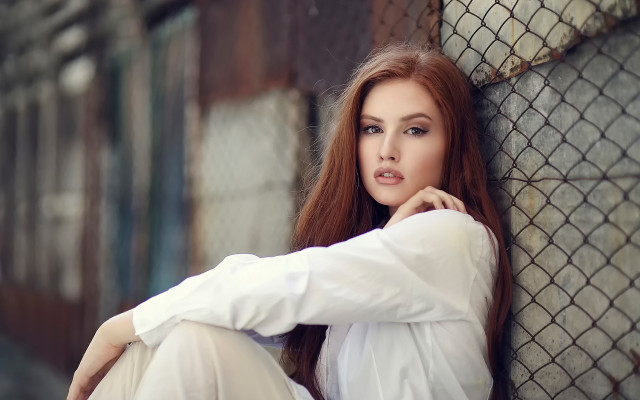 Woman fence hands on knees free wallpaper - medium preview image