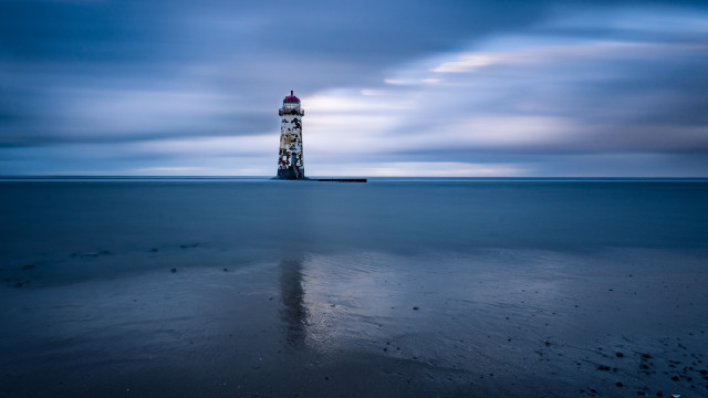 Lighthouse beach cloudy sky reflection free wallpaper - medium preview image