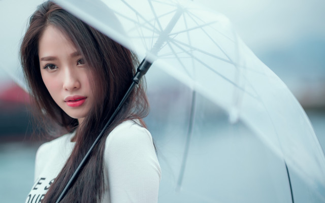 Woman smiling umbrella outdoors rain free wallpaper - medium preview image