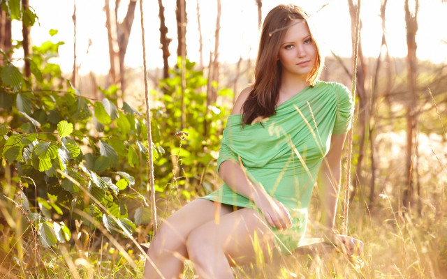 Woman green dress sitting nature free wallpaper - medium preview image