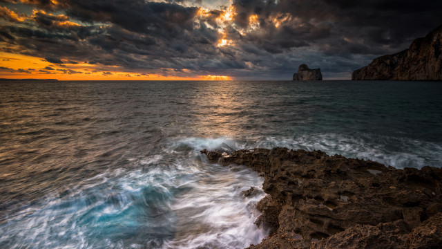 Rocky cliff sunset water clouds free wallpaper - medium preview image