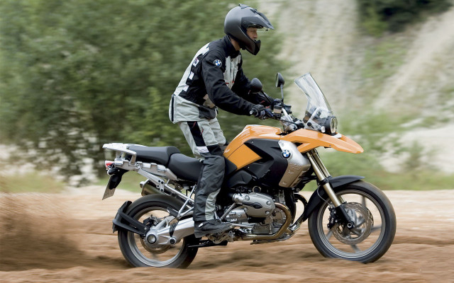 Motorcycle rider dirt road forest free wallpaper - medium preview image