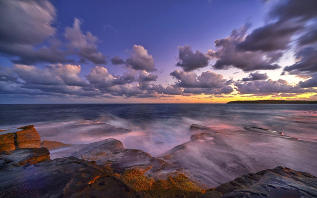 Rocky beach sunset clouds cityscape free wallpaper - medium preview image