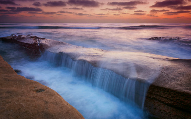 Waterfall ocean sunset clouds red free wallpaper - medium preview image