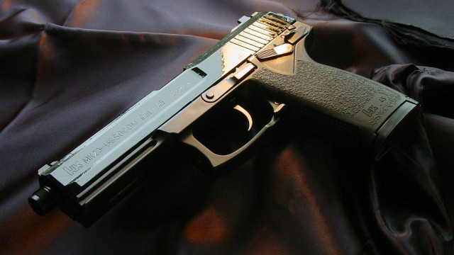 Gun black cloth background puzzle free wallpaper - medium preview image