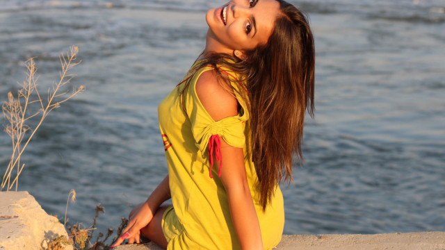 Woman yellow dress water ponytail free wallpaper - medium preview image