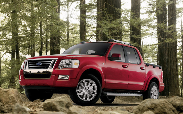Red truck forest rocks bush free wallpaper - medium preview image