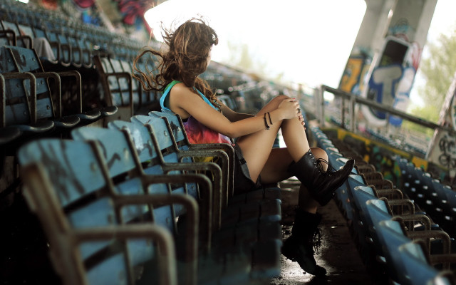 Woman stadium bench crossedlegs fashion free wallpaper - medium preview image