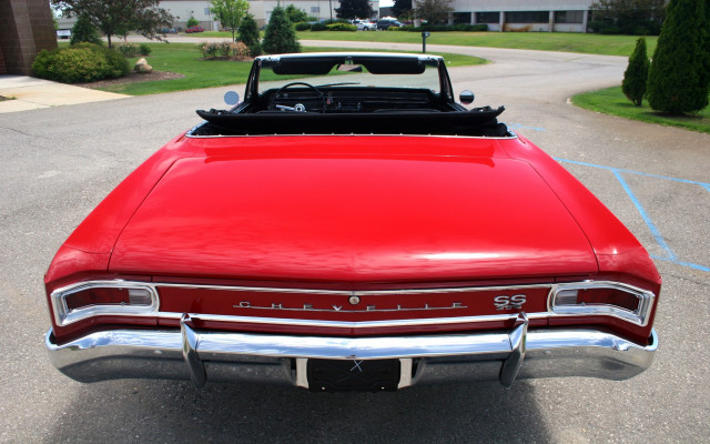 Red car parked next to free wallpaper - medium preview image