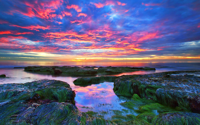 Colorful sunset rocky beach water free wallpaper - medium preview image