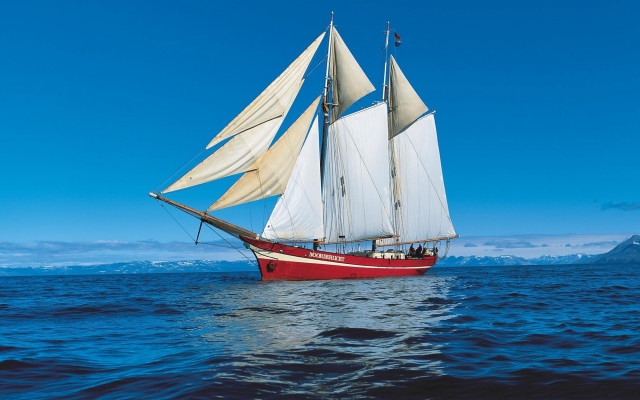 Sailboat ocean mountains blue sky free wallpaper - medium preview image