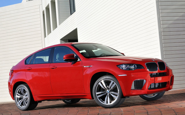 Red car building white wall free wallpaper - medium preview image