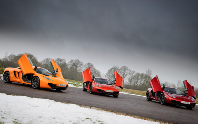 Orange sports cars snowy road free wallpaper - medium preview image