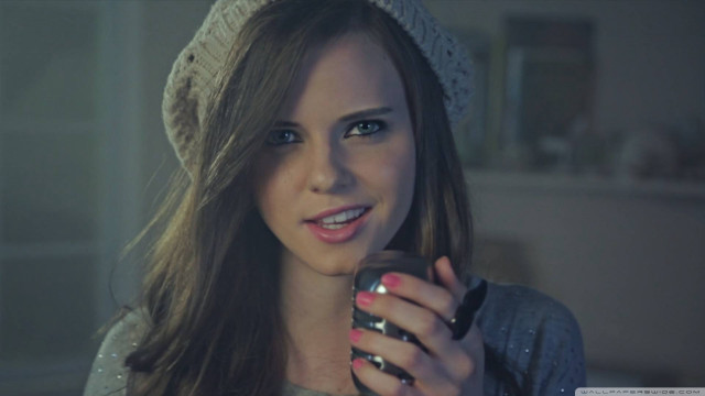 Woman holding cell phone smiling #3 free wallpaper - medium preview image