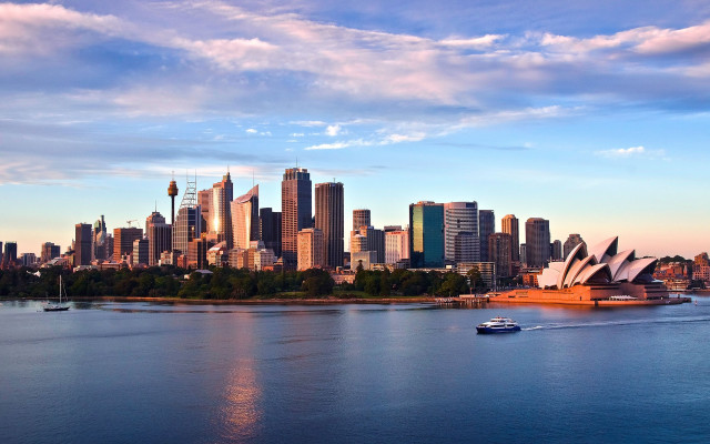 City skyline boat clouds blue free wallpaper - medium preview image