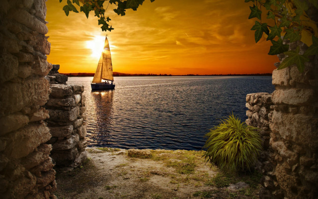 Sailboat sunset archway beach matte free wallpaper - medium preview image