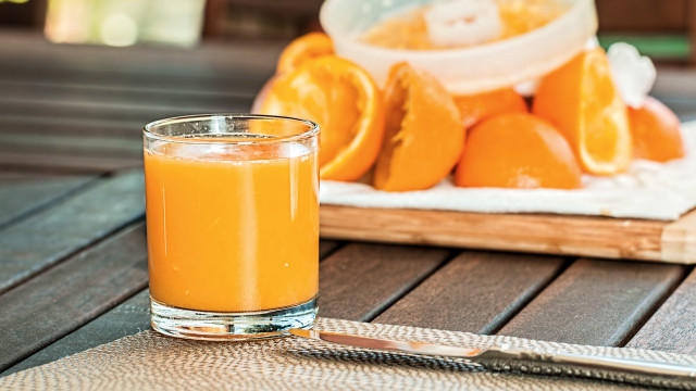 Orange juice glass wooden table free wallpaper - medium preview image