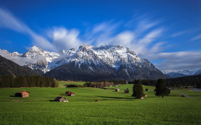 Green field mountains clouds houses free wallpaper - medium preview image