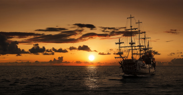 Ship sunset ocean clouds horizon free wallpaper - medium preview image