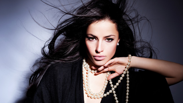 Woman pearl necklace black jacket free wallpaper - medium preview image