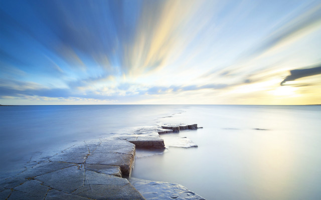 Sunset water rocks blue sky free wallpaper - medium preview image