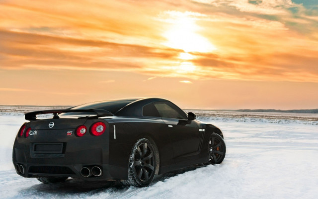 Black sports car snow sunset free wallpaper - medium preview image