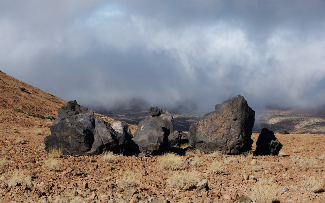 Rocky hill cloudy sky drygrass free wallpaper - medium preview image