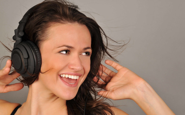 Woman headphones smiling blowing wind free wallpaper - medium preview image