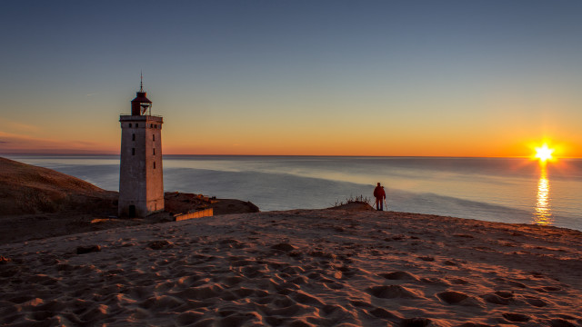 Lighthouse beach sunset person tilt free wallpaper - medium preview image