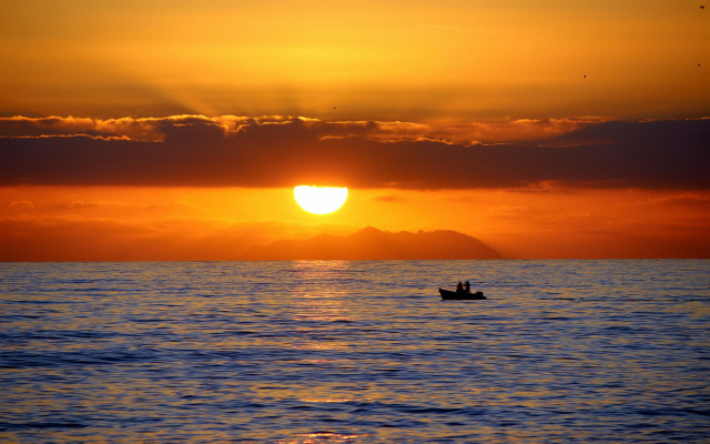 Sunset boat water mountain clouds free wallpaper - medium preview image