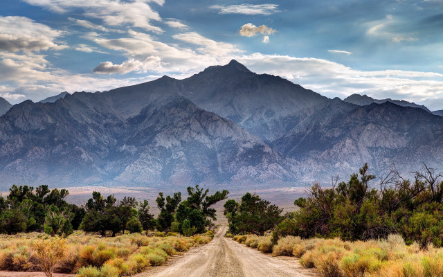 Mountain road clouds bushes sky free wallpaper - medium preview image