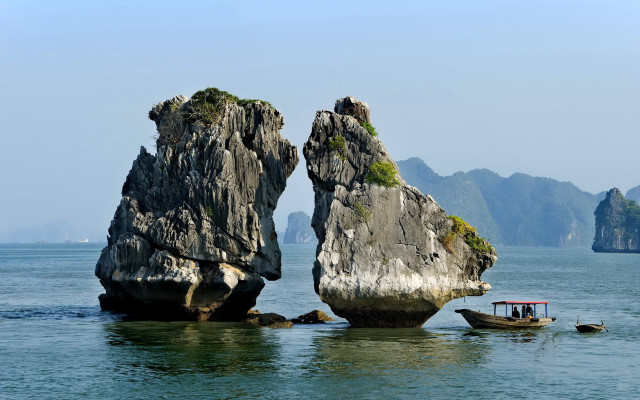 Boats rocks mountains ocean scenery free wallpaper - medium preview image