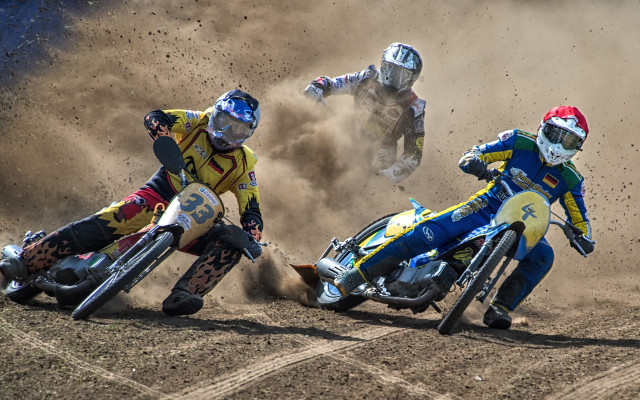 Motorcyclists racing dirt field falling free wallpaper - medium preview image