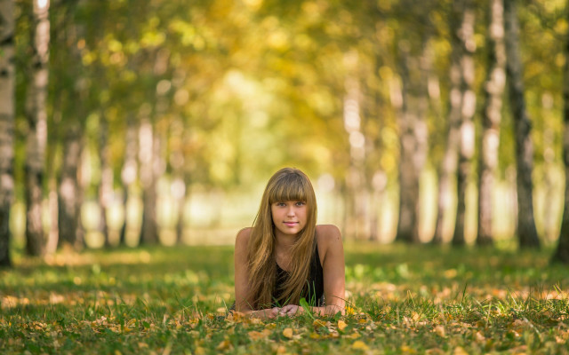 Woman forest ground leaves bokeh free wallpaper - medium preview image