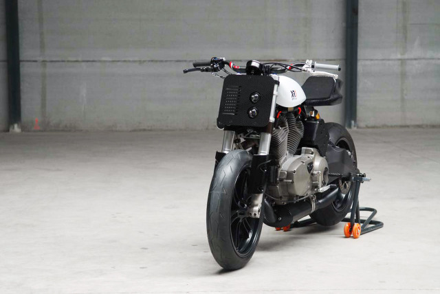 Motorcycle parked garage wall open free wallpaper - medium preview image