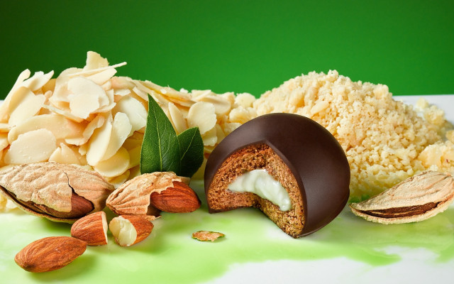 Chocolate candy almonds green background free wallpaper - medium preview image