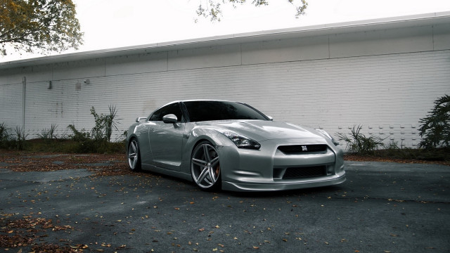 Silver sports car white building free wallpaper - medium preview image