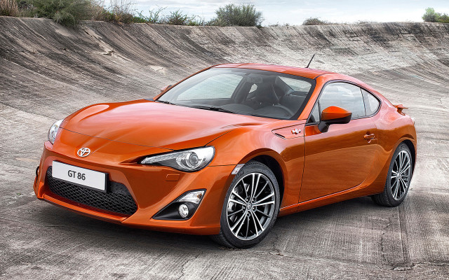 Bright orange sports car skateboard free wallpaper - medium preview image