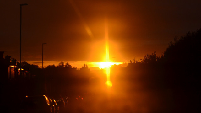 Bright sunset orange sky cityscape free wallpaper - medium preview image