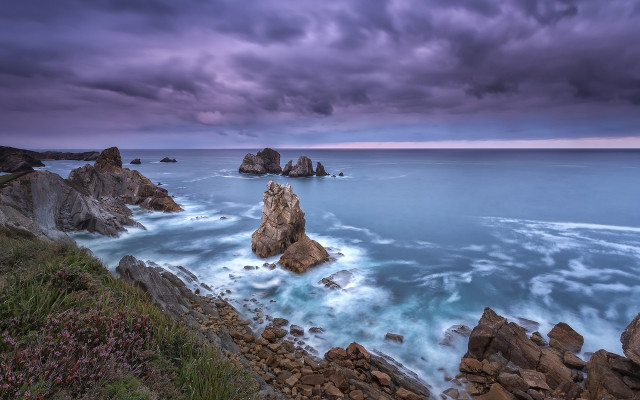Rocky shore stormy sky water free wallpaper - medium preview image