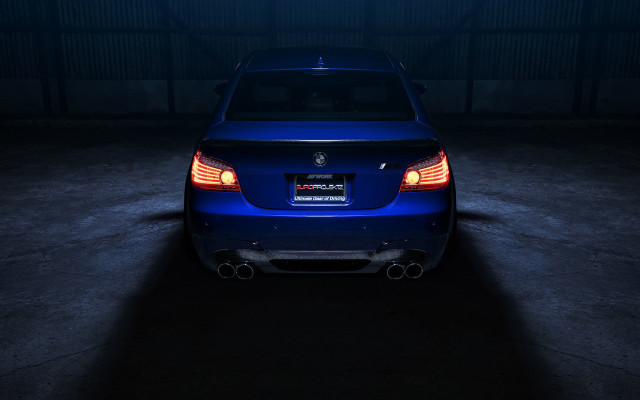 Blue car dark garage illuminated free wallpaper - medium preview image