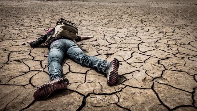 Person laying backpack desert brick free wallpaper - medium preview image