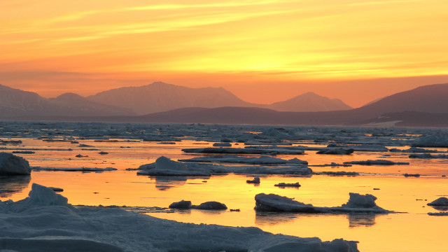 Sunset icebergs mountains water orange free wallpaper - medium preview image