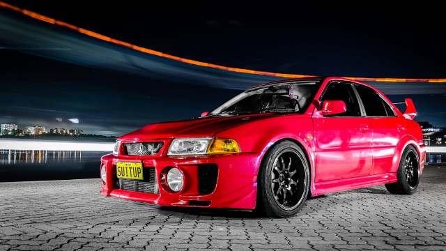 Red car brick road night free wallpaper - medium preview image