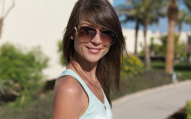Woman sunglasses smiling palm tree free wallpaper - medium preview image