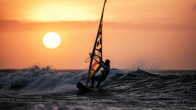 Surfing wave ocean sunset mountain #2 free wallpaper - medium preview image
