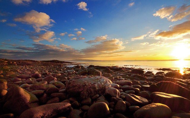 Rocky beach sunset clouds water free wallpaper - medium preview image
